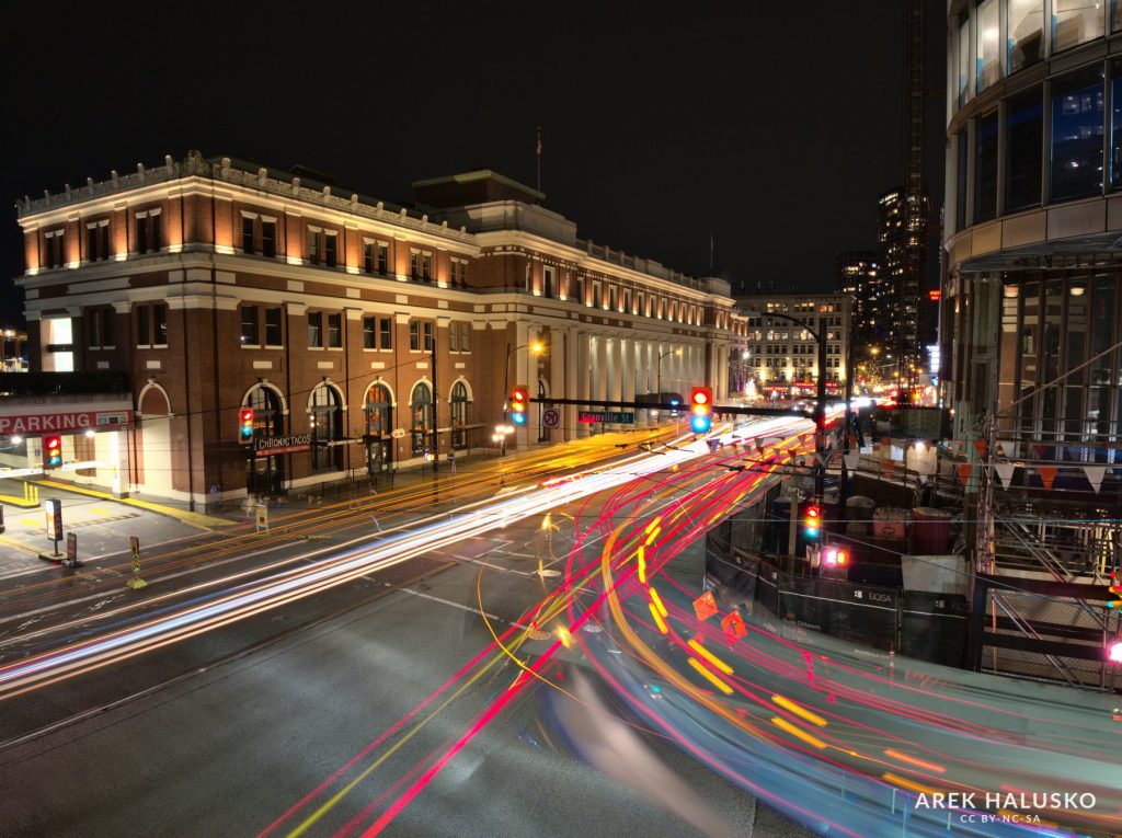 Vancouver Waterfront station at night with car light trails.
