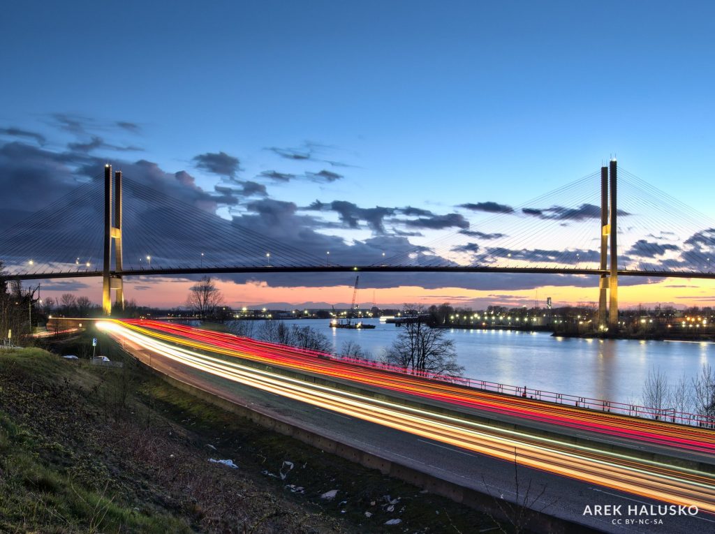 Alex Fraser Bridge at sunset with car light trails