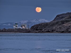 Kamloops BC large moon over top of pulp mill